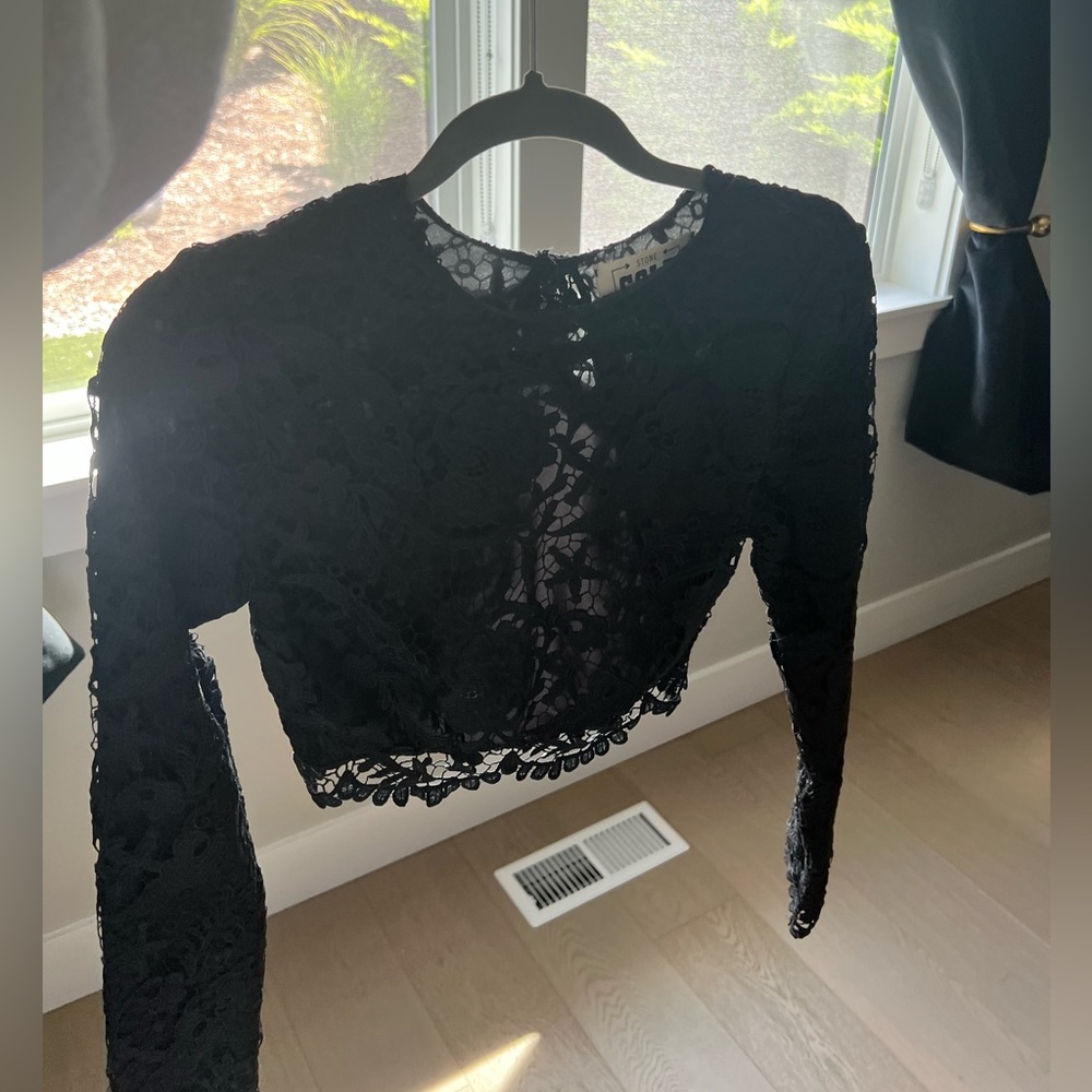 Black crop top. Open back.